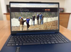Picture of a computer with Audubon North Carolina website on the screen
