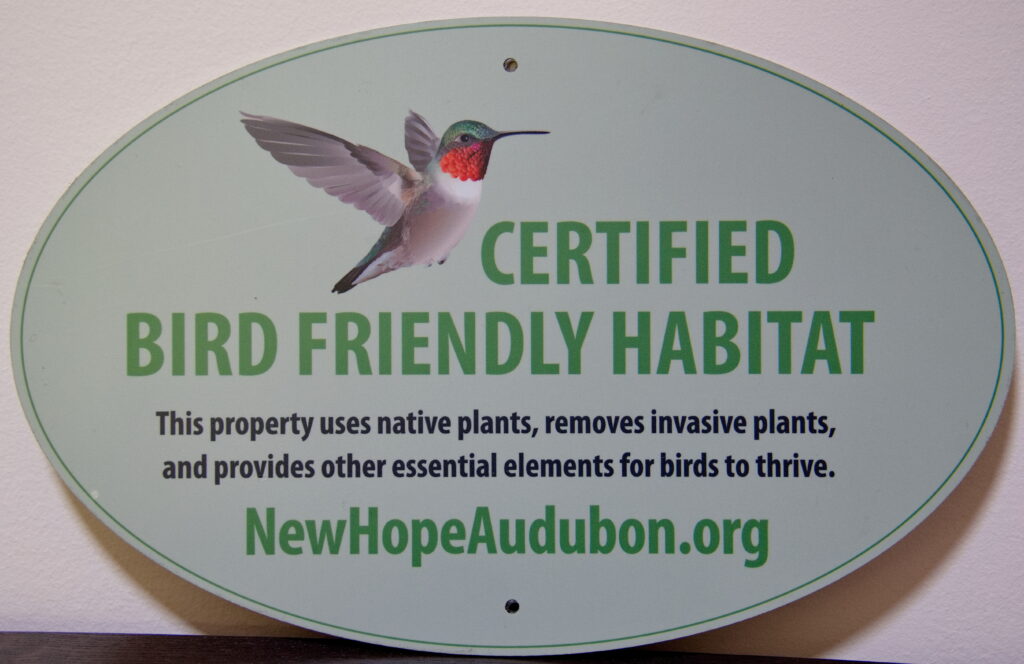 A photo of the New Hope Audubon Certified Bird Friendly Habitat plaque.